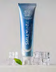 SmileSense™ Hydroxyapatite Toothpaste with BritePop™ Technology by SeneGence: A blue toothpaste tube above ice cubes beside a mint leaf.