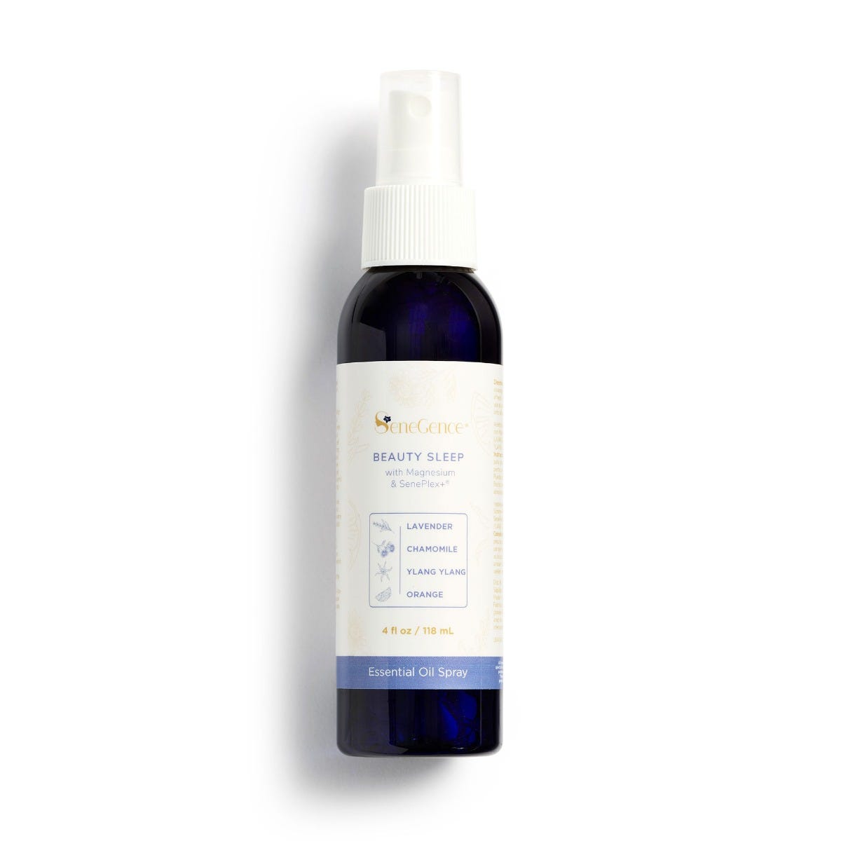 A dark Beauty Sleep spray bottle with a white spray top and a label naming lavender, chamomile, ylang ylang and orange.