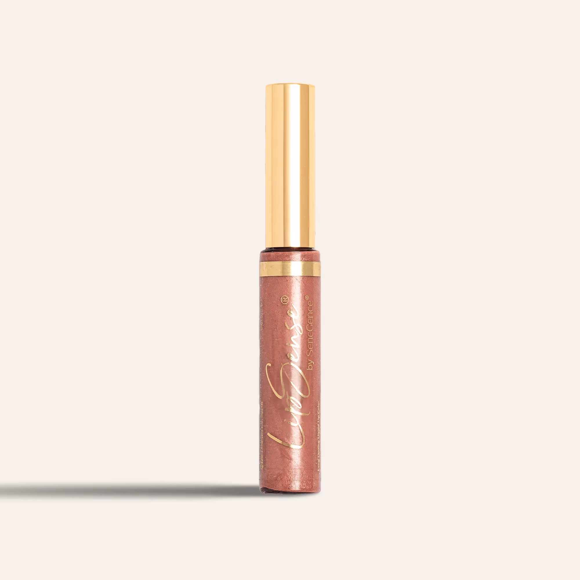A LipSense® Lip Color tube with a gold cap and warm pink shimmering color.