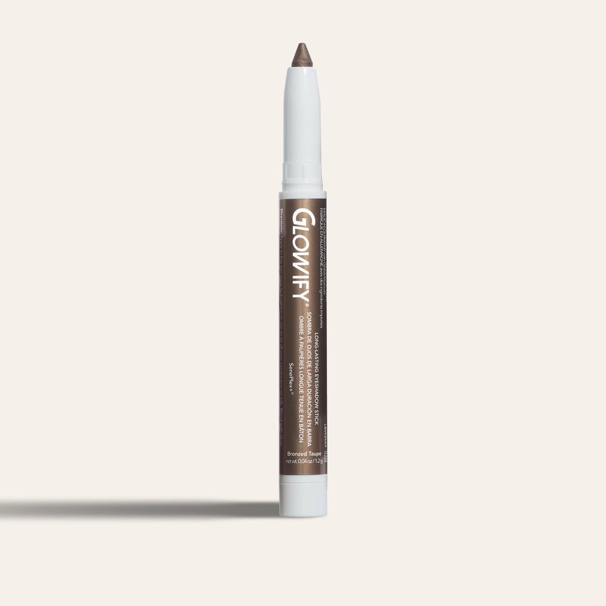 A brown eyeshadow stick with white ends and an exposed tip, Glowify® Long-Lasting Eyeshadow Stick.