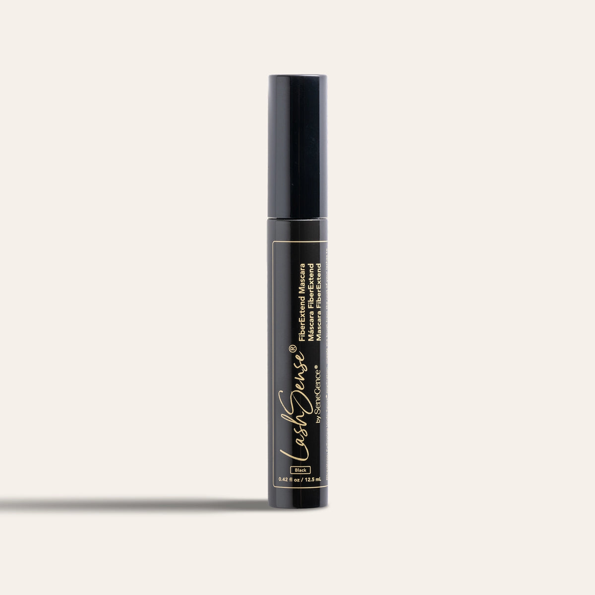 A glossy black mascara tube with a black cap and gold lettering framed by a thin gold outline, LashSense FiberExtend Mascara.