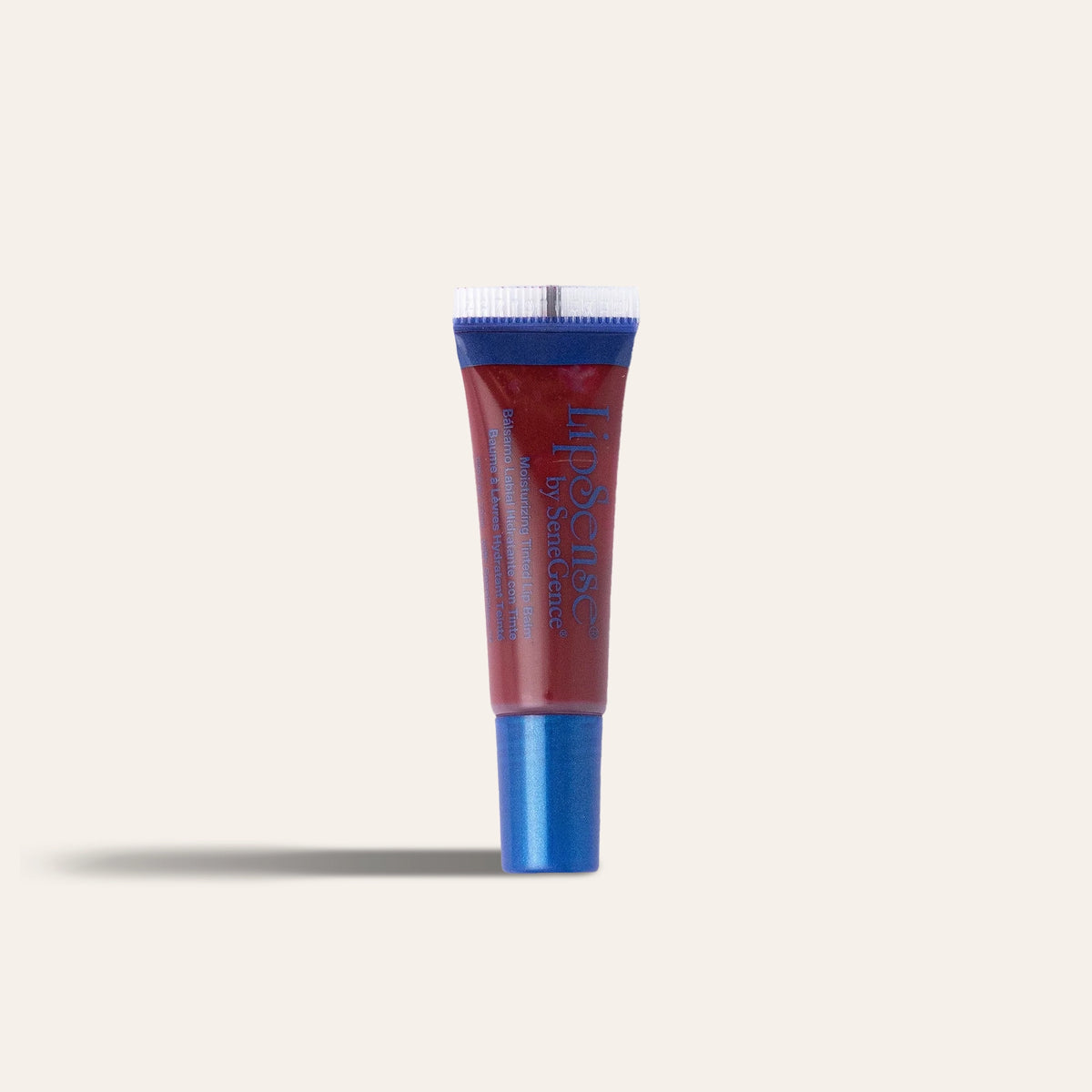 A red balm tube with a blue cap, LipSense® Moisturizing Lip Balm.