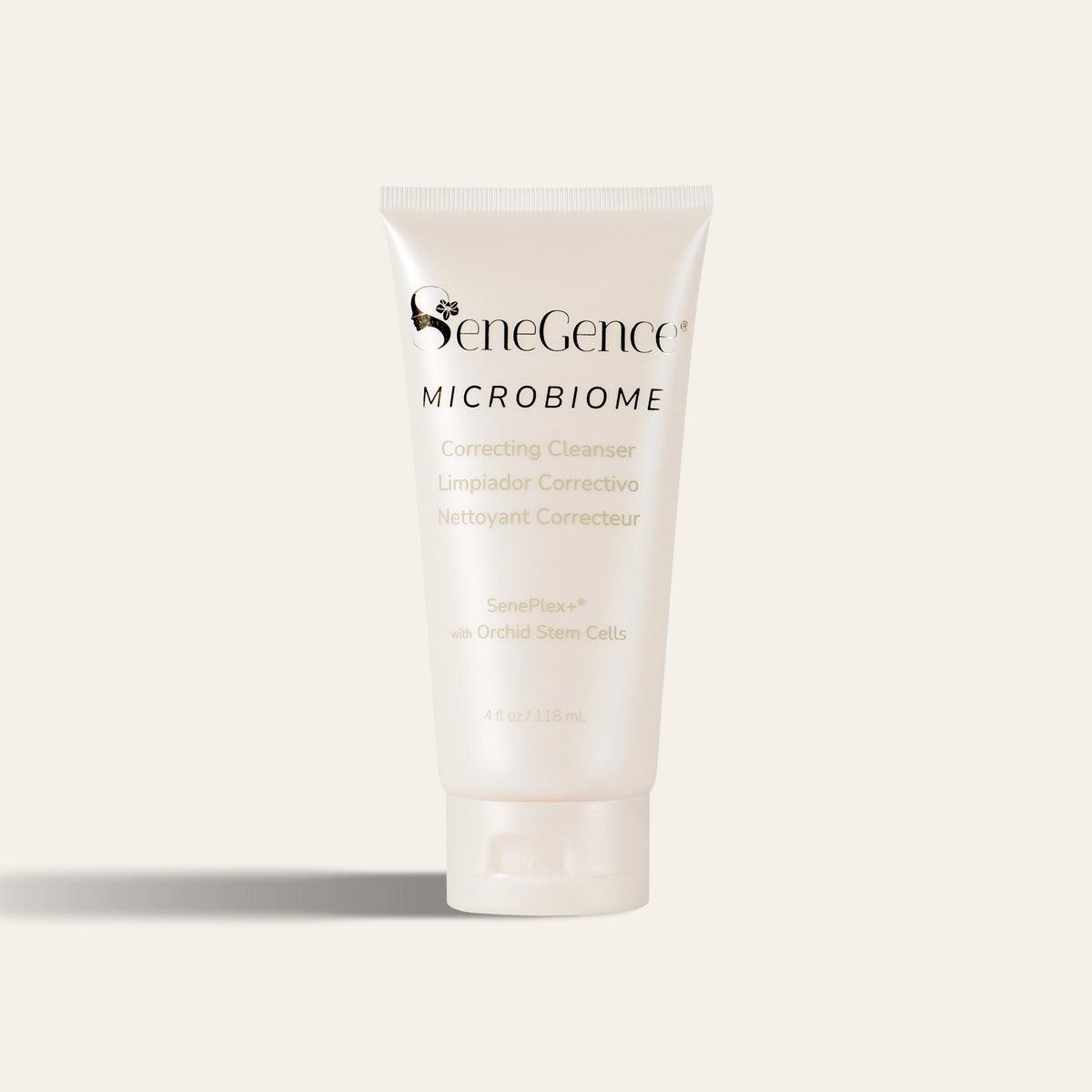 A cream cleanser tube with a white flip cap, Microbiome Correcting Cleanser.