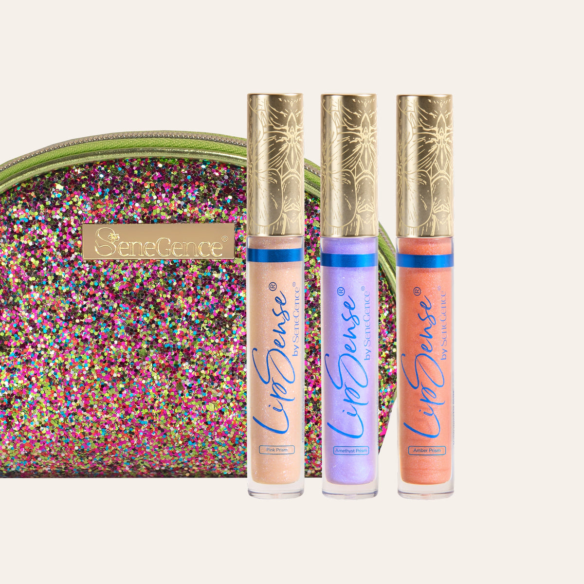 Three gold-capped gloss tubes beside a multicolored sparkling pouch, Prismatic LipSense Gloss Collection.