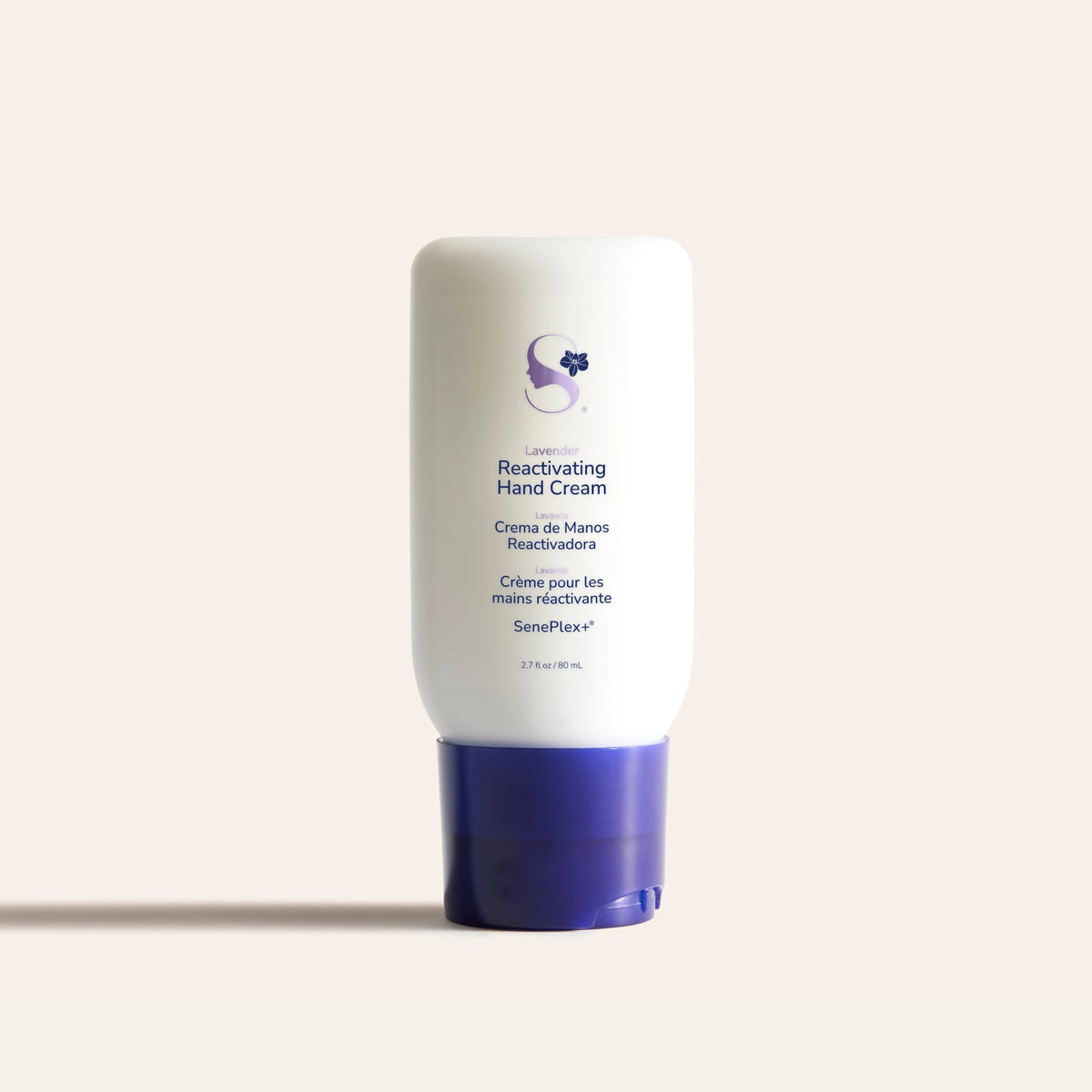 A white hand-cream tube with a blue flip cap, Reactivating Hand Cream.