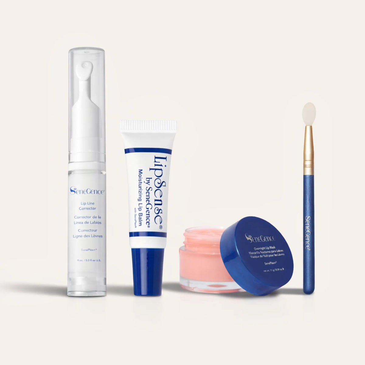 A lip-care pump bottle, balm tube, pink mask pot and applicator, The Ultimate Lip Care Collection.