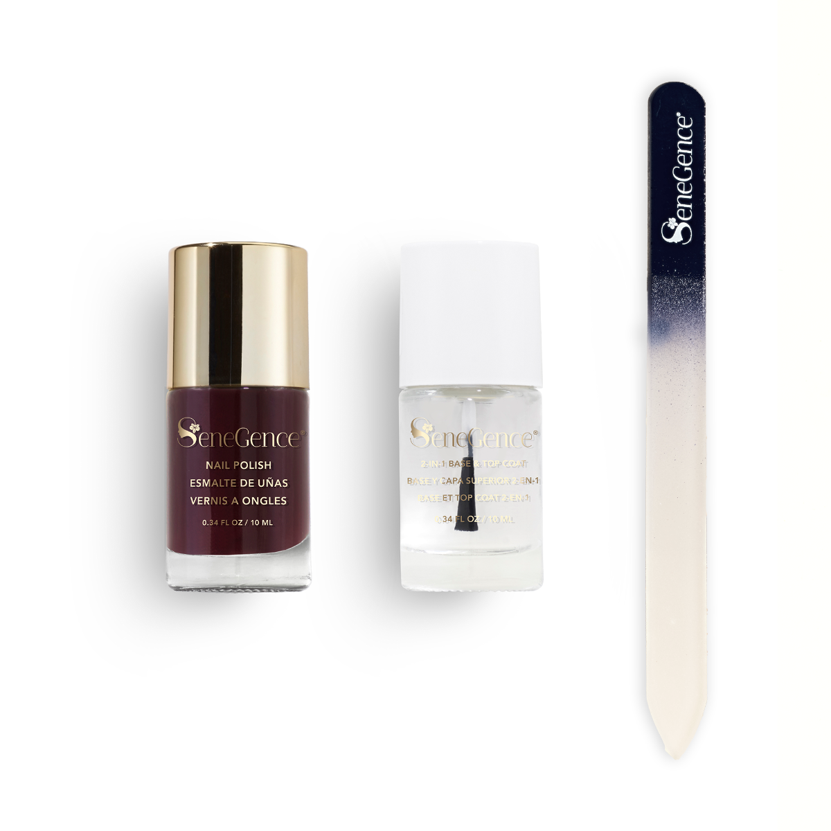A deep wine nail polish bottle with a gold cap, a clear 2-in-1 base-and-top-coat bottle with a white cap and a navy-to-white ombré glass nail file, Wine Not Holiday Nail Gift Set.